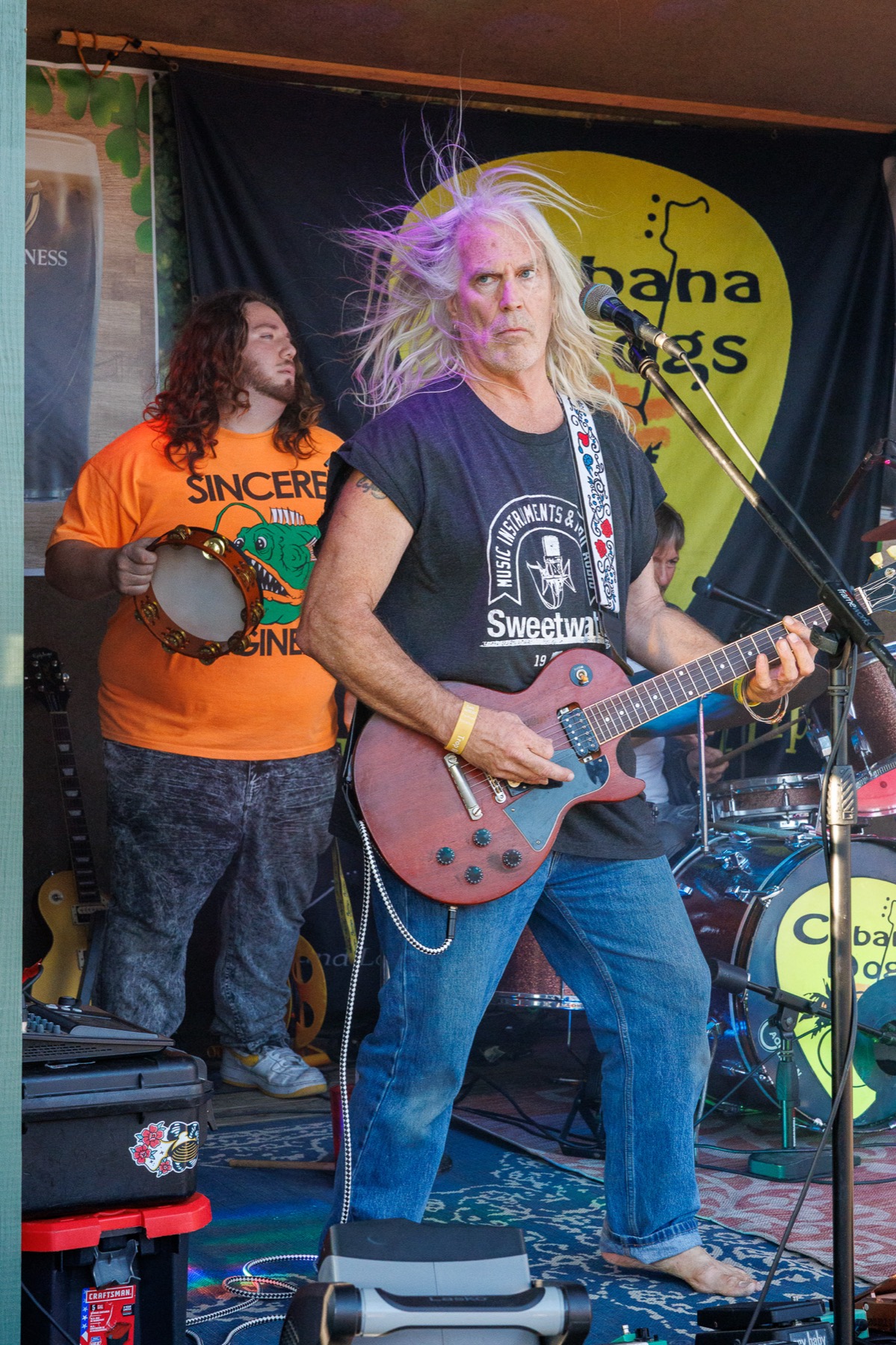 Cabana Dogs guitarist posing mid-performance with hair standing up from static electricity